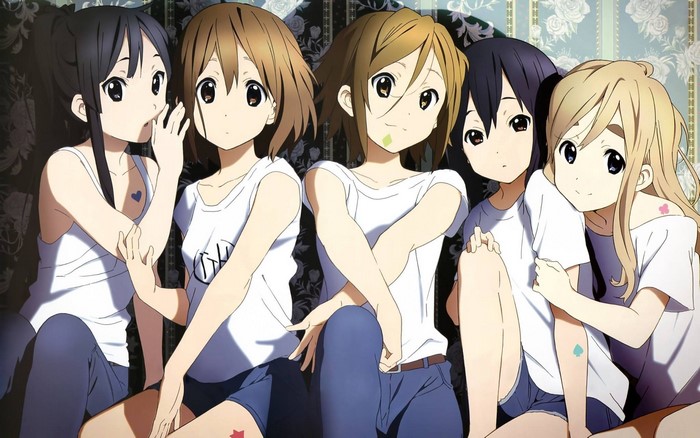 K-On! characters Yui, Ritsu, Mio, Tsumugi, and Azusa sitting together