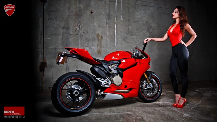 Woman in red outfit with Ducati 1199 motorcycle