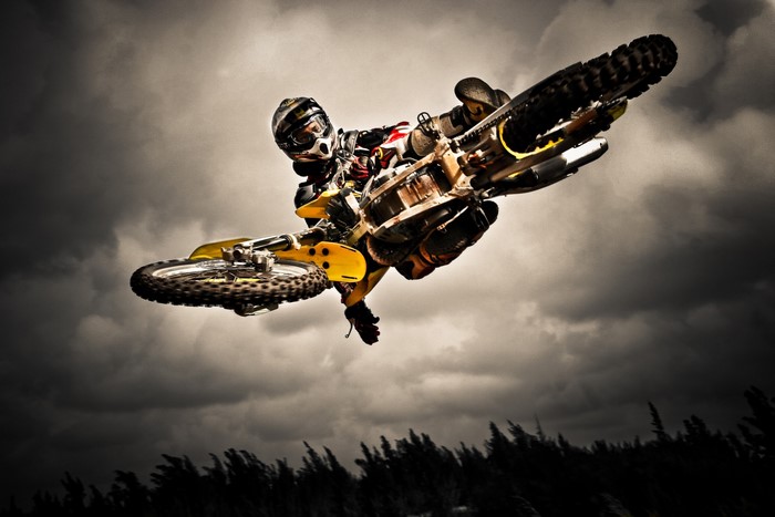 Motocross rider performing a jump