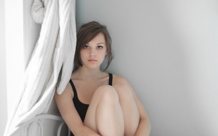Imogen Dyer Sitting Calmly with Green Eyes