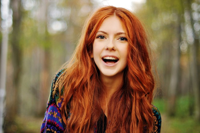 Woman with long red hair outdoors