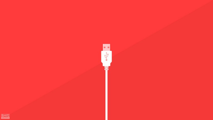 Minimalist USB cable on red background