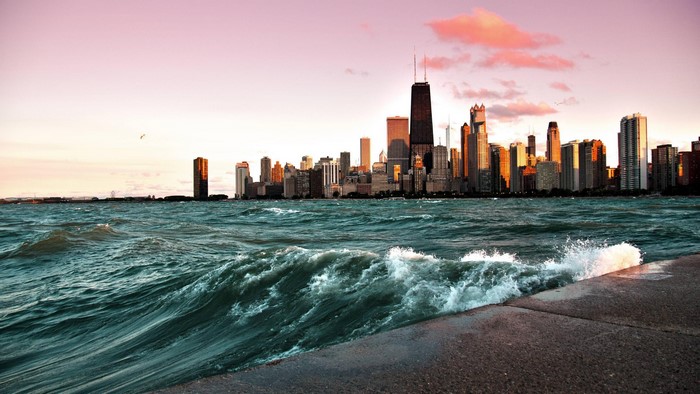 Chicago cityscape with waves at sunset