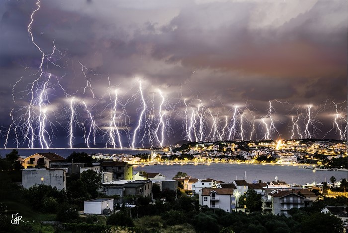 Lightning Storm Over Coastal Cityscape