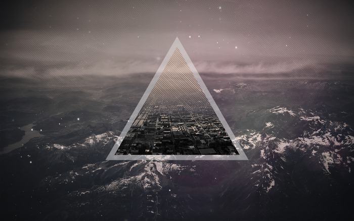 Geometric triangle overlay on mountain landscape with city