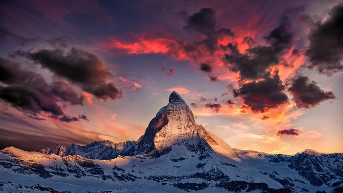 Matterhorn mountain at sunset with colorful clouds