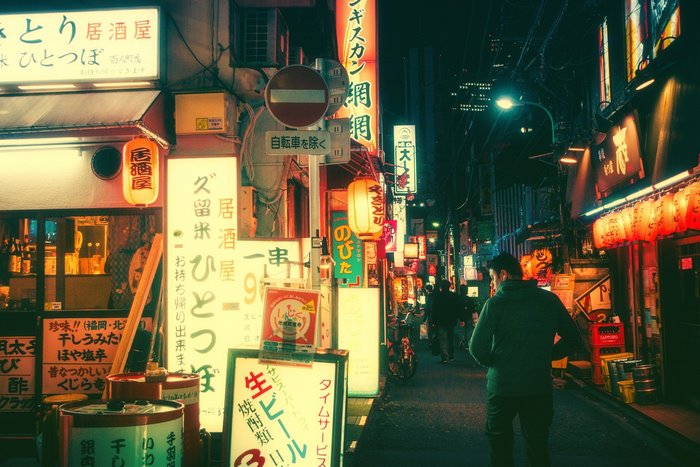 Japanese street at night with neon signs