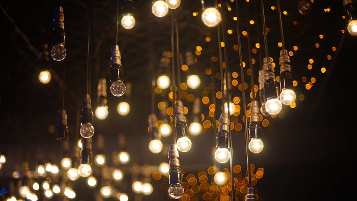 Hanging Edison light bulbs with bokeh background