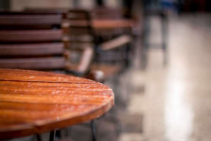 Wet wooden table in a restaurant