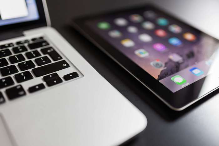 MacBook and iPad with App Icons 4K