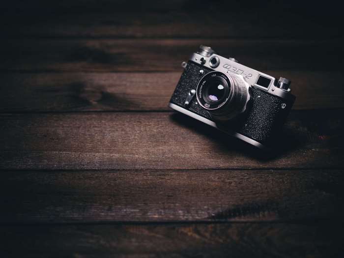 Vintage analog camera on a wooden surface