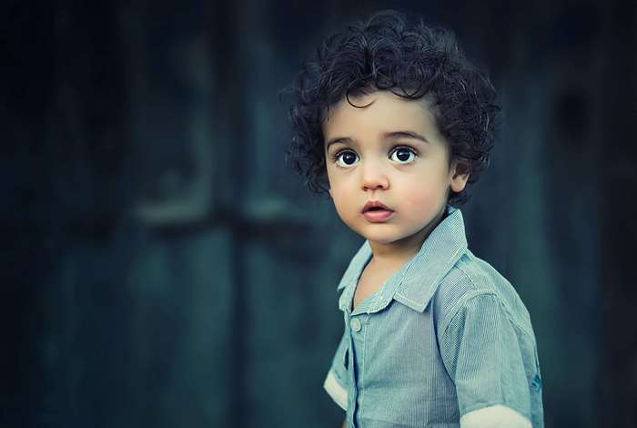 Portrait of a young boy with curly hair