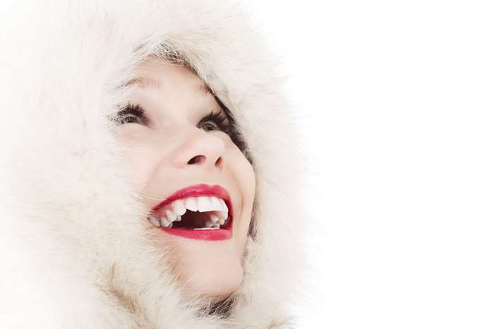 Woman in fur hood smiling with red lipstick 4K