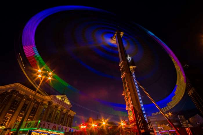 Long exposure of a carnival ride at night