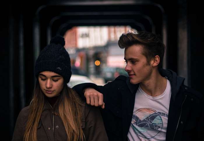 Teenage couple in urban setting