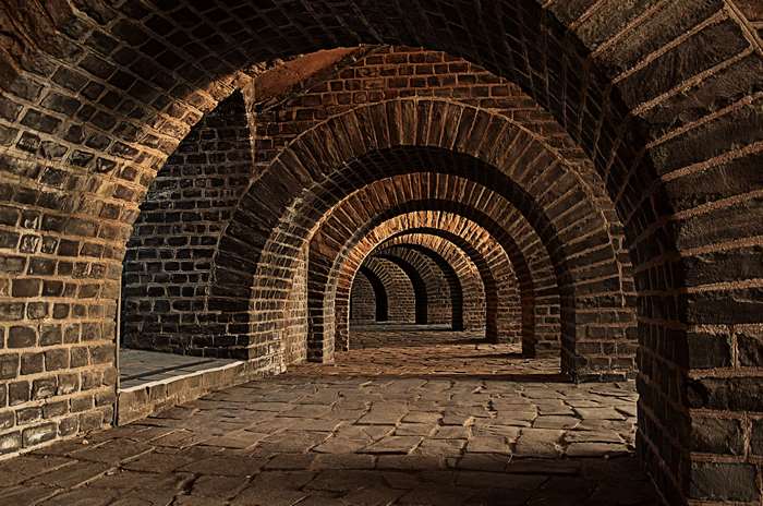 Brick Arches and Stone Floor in a Vaulted Cellar