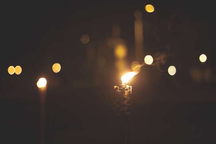Torch with bokeh lights at night