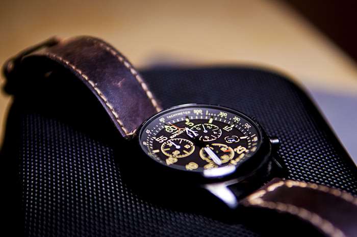 Close up of a luxury chronograph watch with leather strap