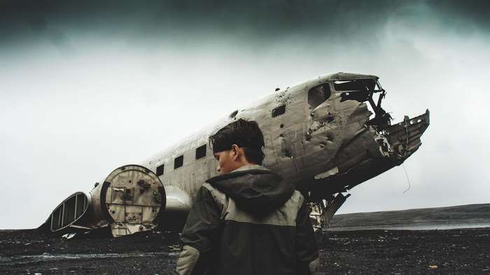 Person standing by a crashed airplane wreck