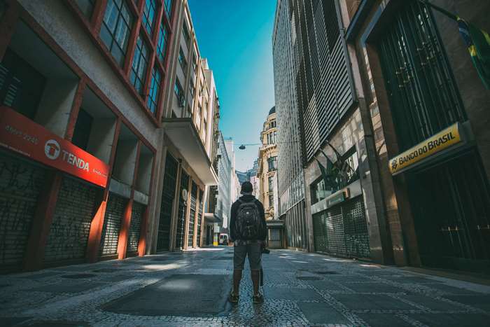 Man with backpack in a street in Brazil 4K