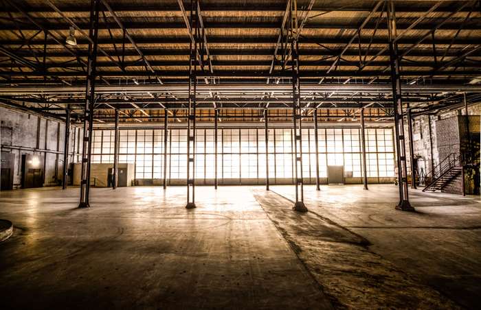Industrial warehouse hall with large windows