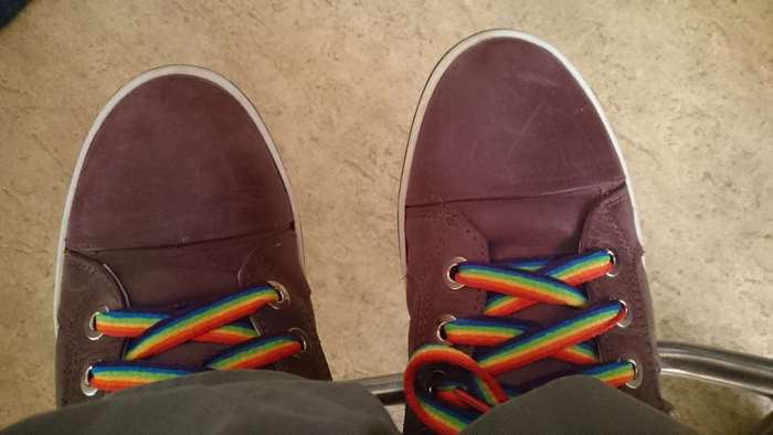 Close-up of shoes with rainbow shoelaces