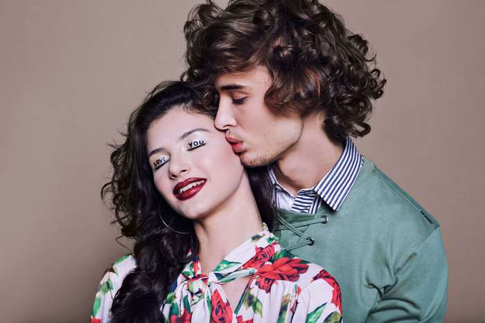 Couple with 'love you' written on eyelids