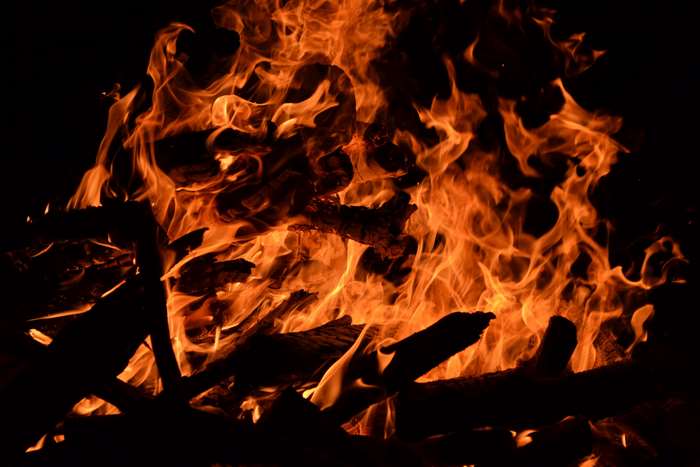 Burning logs with orange and red flames 4K