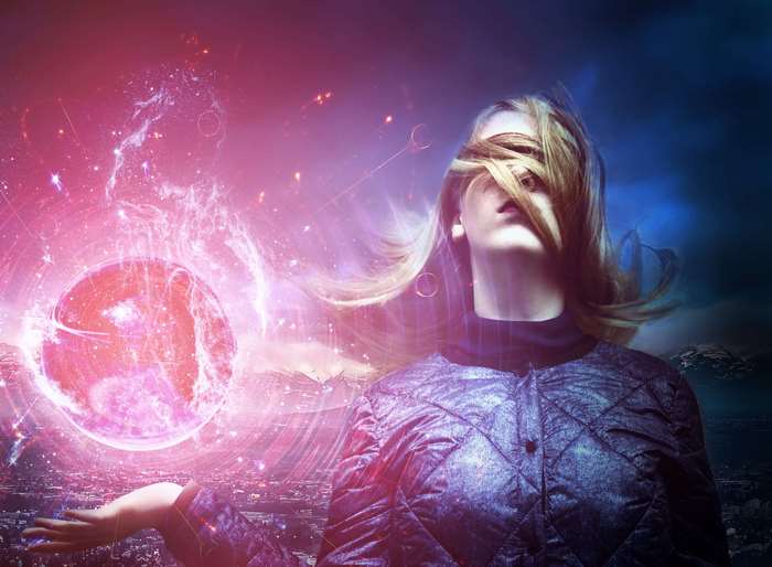 Woman holding a glowing cosmic orb