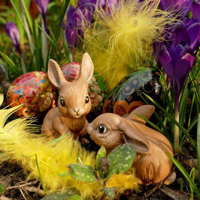 Easter Bunnies and Decorated Eggs Among Crocuses