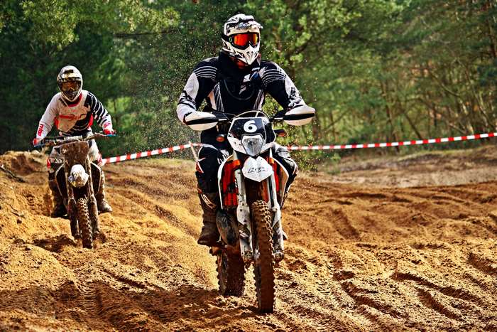 Motocross riders racing on a dirt track