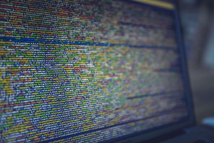 Close-up of colorful computer source code on a laptop screen