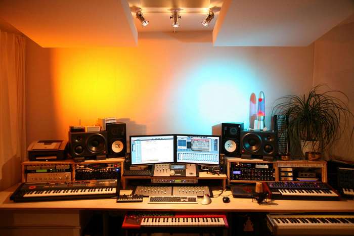 Music studio with synthesizers and monitors