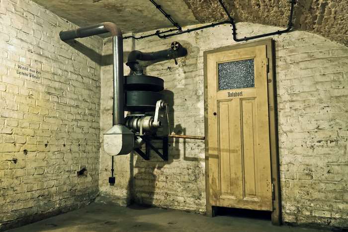 Vintage air raid shelter with machinery and door