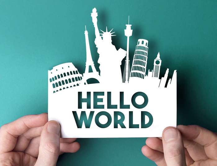 Paper Cutout of World Landmarks and "Hello World" Text