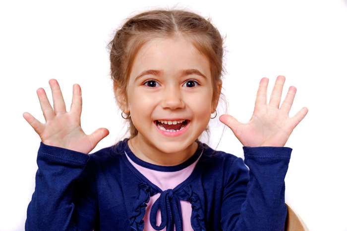 Joyful Smiling Little Girl Showing Hands