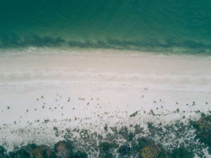 Aerial view of a sandy beach and ocean