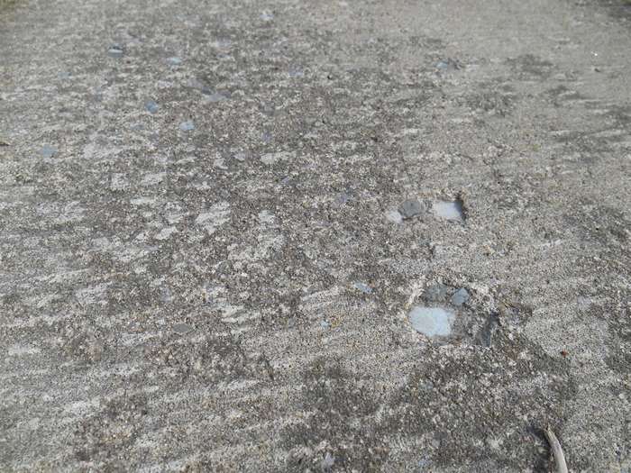 Close-up of a worn and dirty concrete surface