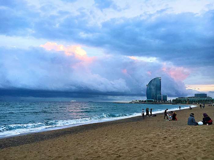 Barcelona beach with W Hotel and stormy clouds
