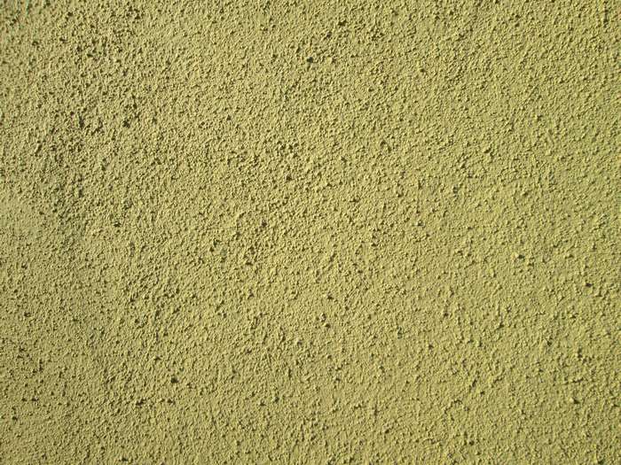 Rough yellow painted wall texture