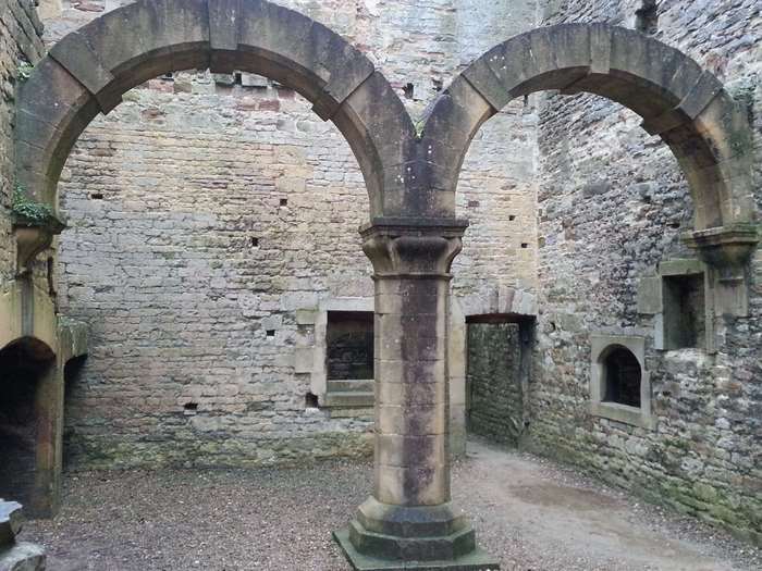 Stone arches and ruins of a castle with windows and doorways