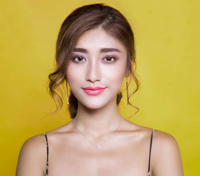 Elegant Woman with Soft Makeup and Stylish Hair