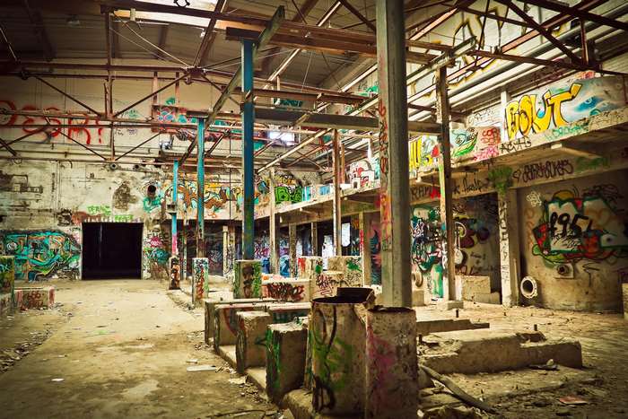 Abandoned building interior with graffiti art