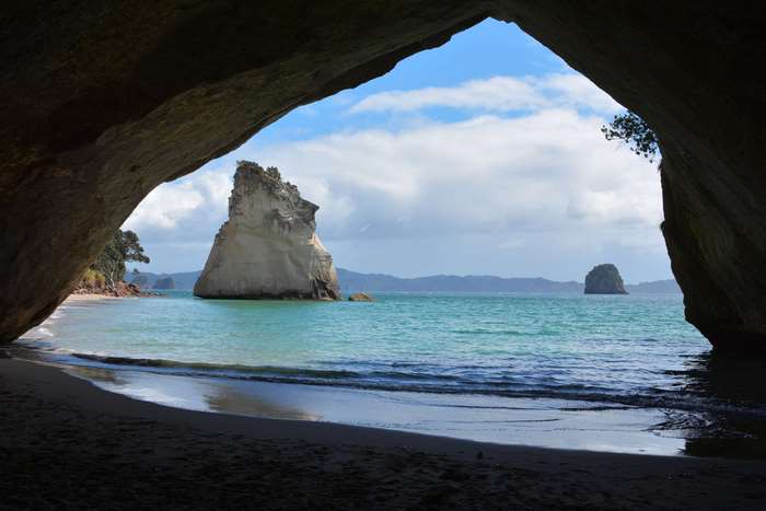 Cathedral Cove beach with rock formations in New Zealand 4K