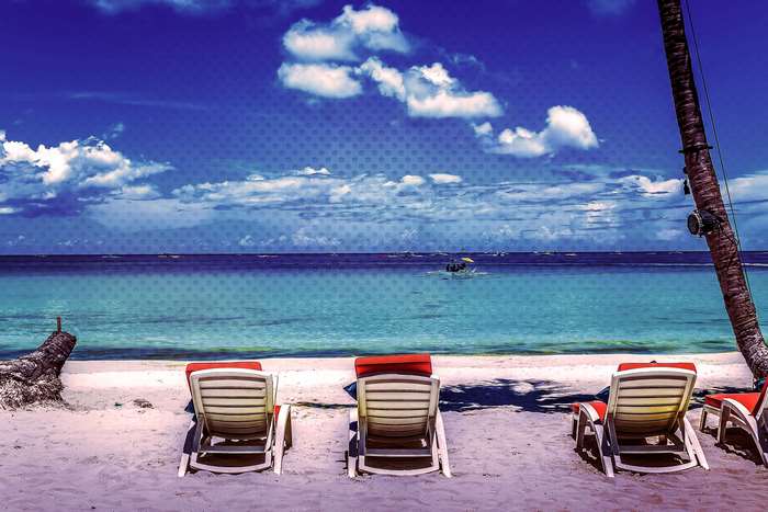 Beach chairs on Boracay beach with turquoise water