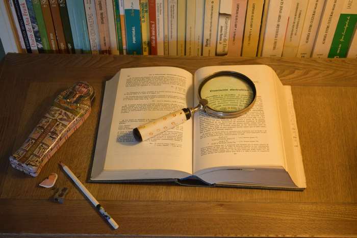 Book with Magnifying Glass and Egyptian Pencil Case