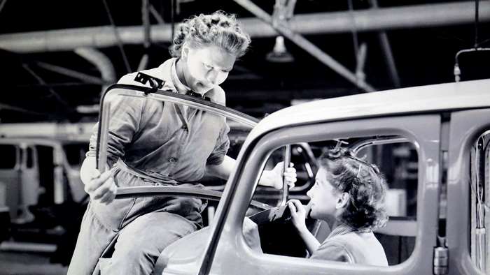 Women working on car assembly line