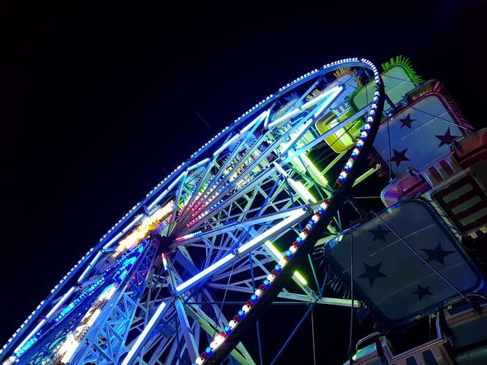 Illuminated Ferris wheel at night
