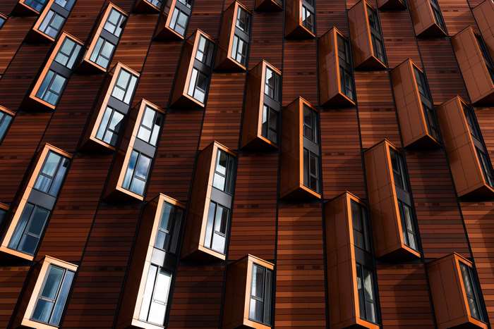 Modern Architecture with Geometric Windows and Wooden Facade
