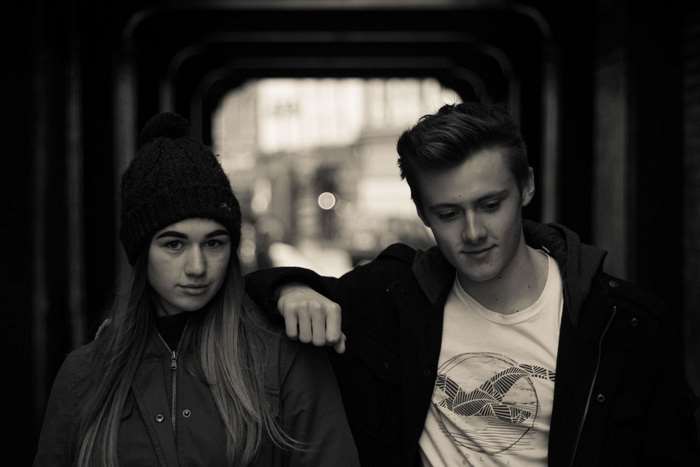 Teenage couple posing in urban setting